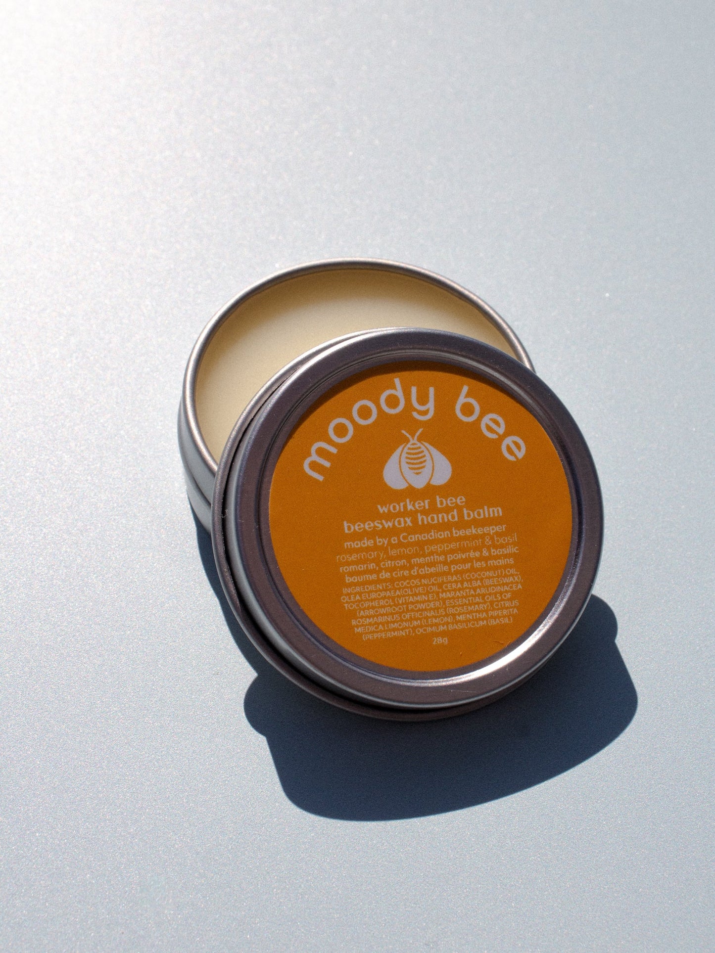 worker bee hand balm with essential oils of lemon, peppermint, rosemary & basil