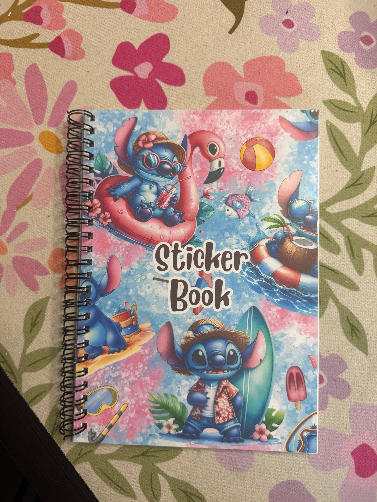 Sticker book with cartoon characters on a floral background