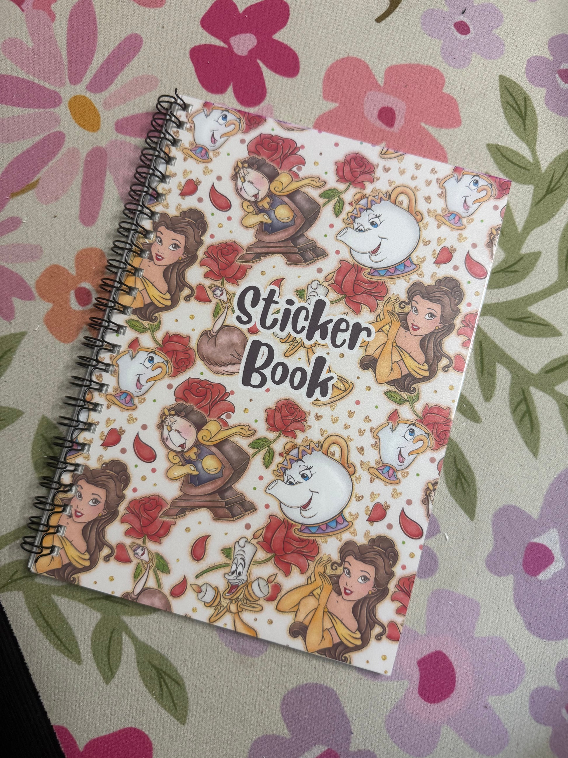 Sticker book with cartoon characters on a floral background